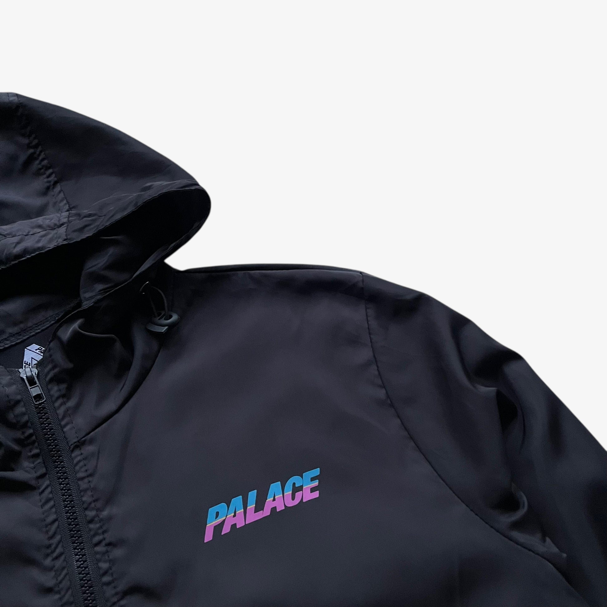 Palace logo on men's vintage Y2K spell out print black hooded jacket.