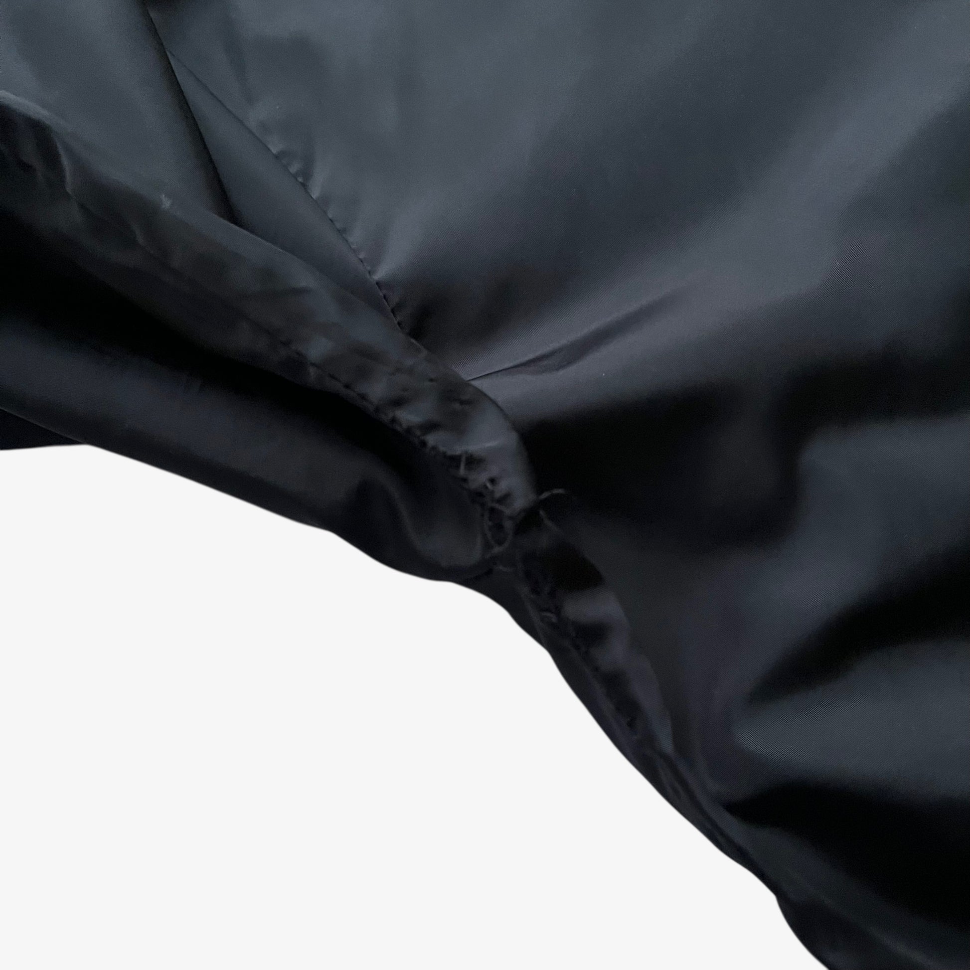 Patina of men's vintage Y2K Palace spell out print black hooded jacket.