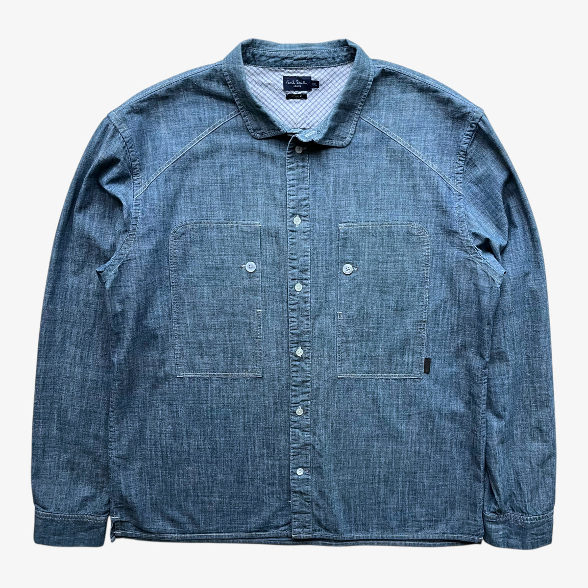 Vintage Y2K men's Paul Smith faded blue denim shirt on a white background.