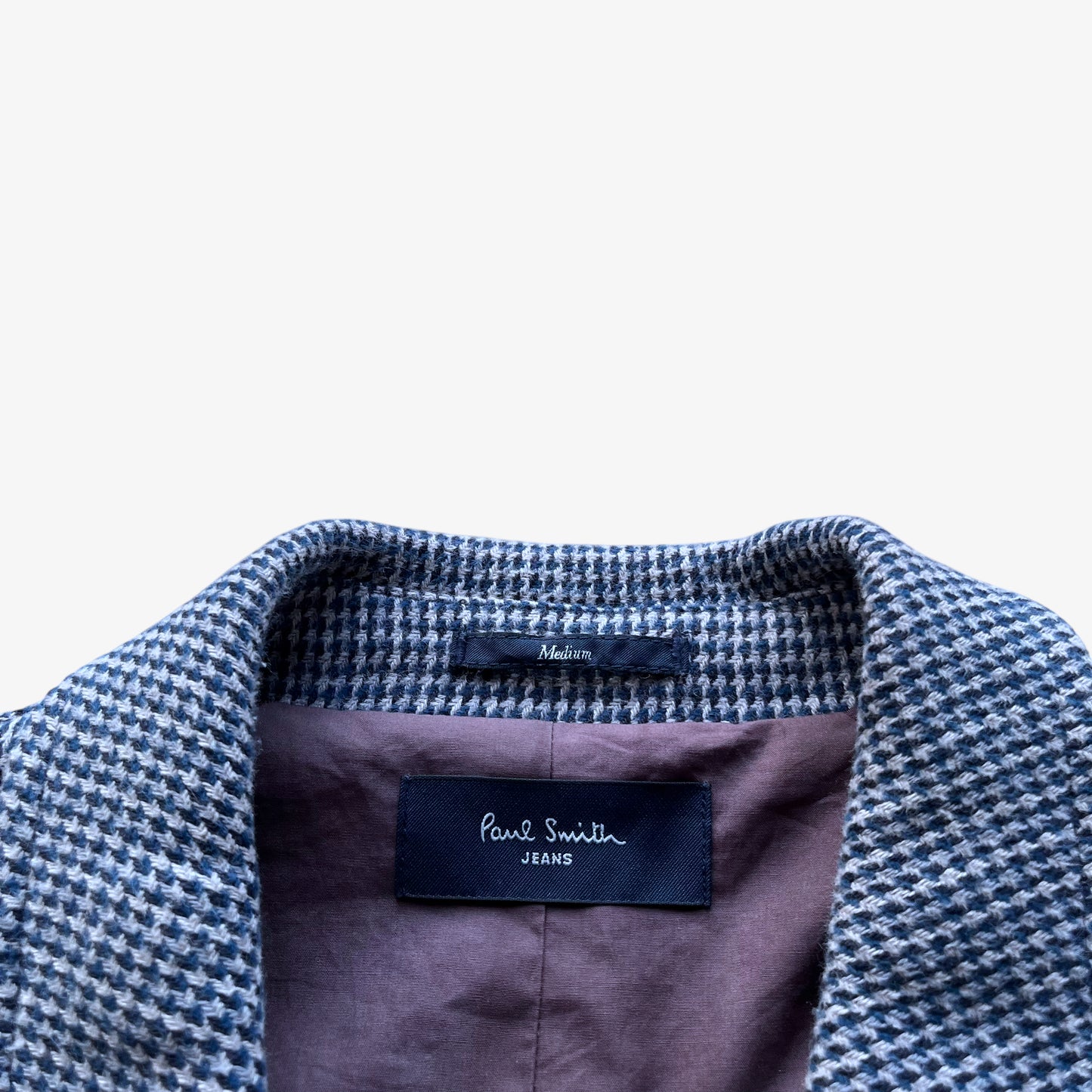 Paul Smith label stitched inside of vintage Y2K men's blue and grey houndstooth print double breasted coat.