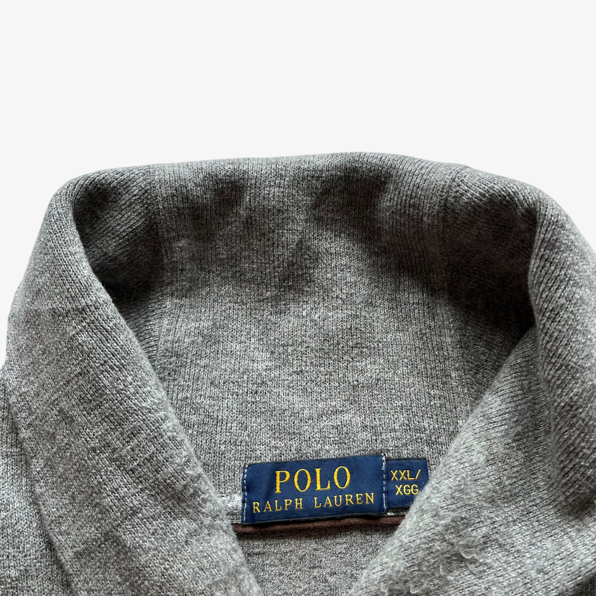 Polo Ralph Lauren label stitched inside of the collar of vintage Y2K men's grey high neck jumper.