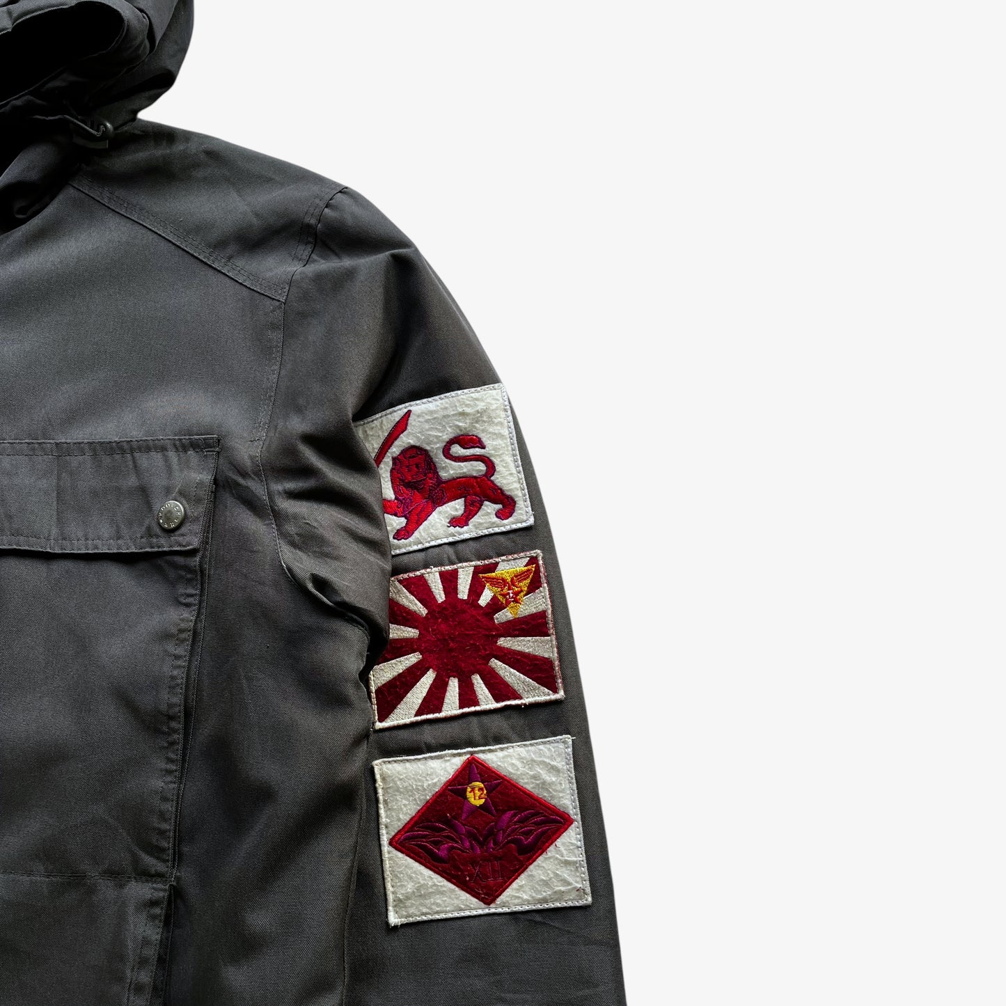 Embroidered badges on men's vintage Y2K Quickshark special aircraft supply grey utility jacket with back spell out.