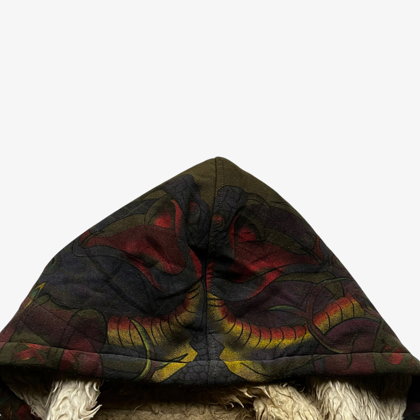 Snake eyes pattern on the hood of vintage Y2K men's Really Point cobra double sided print green hooded jacket.