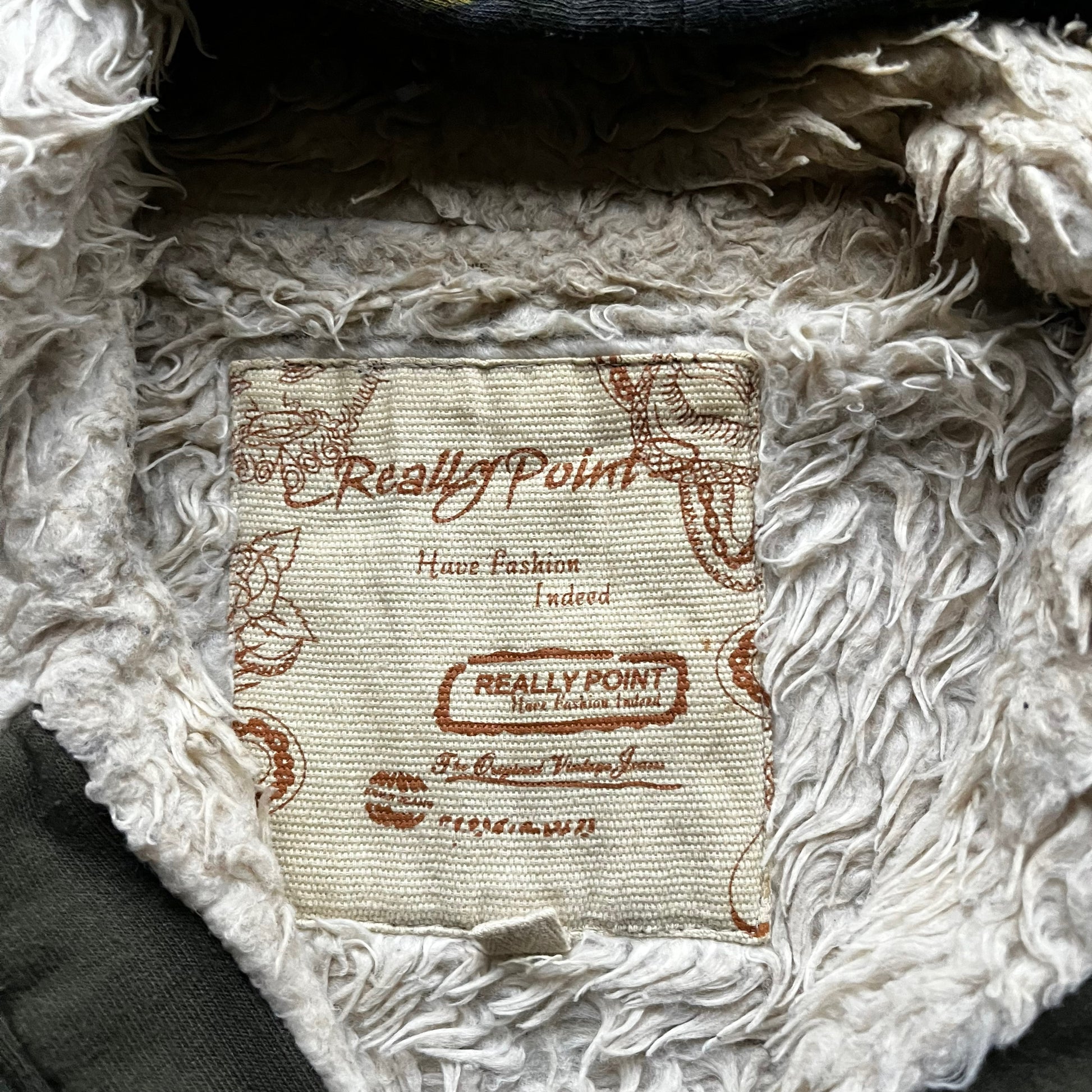 Really Point label stitched inside the neck of vintage Y2K men's Really Point cobra snake double sided print green hooded jacket.