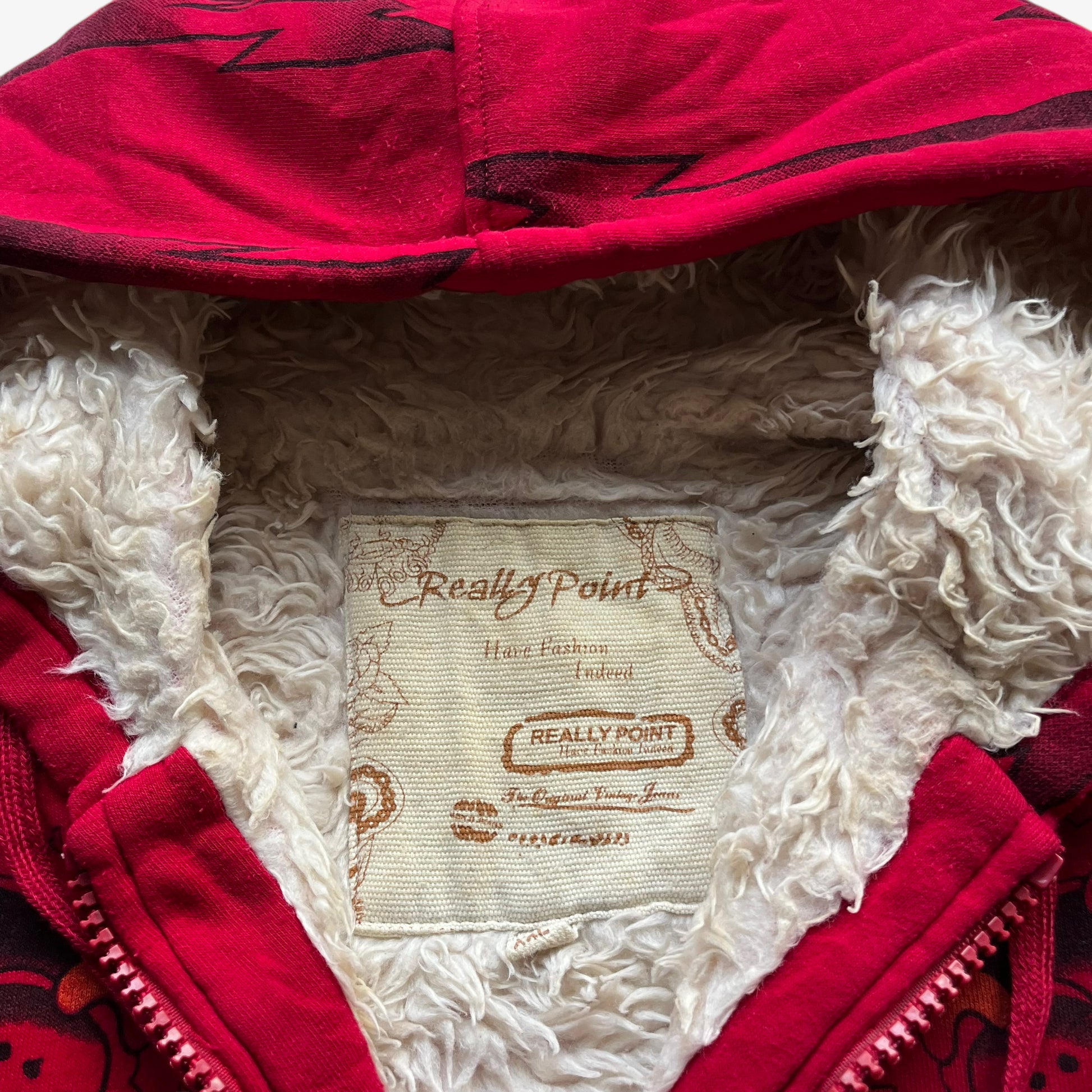 Really Point label on vintage Y2K men's rhinestone skull and panther double sided print red jacket.