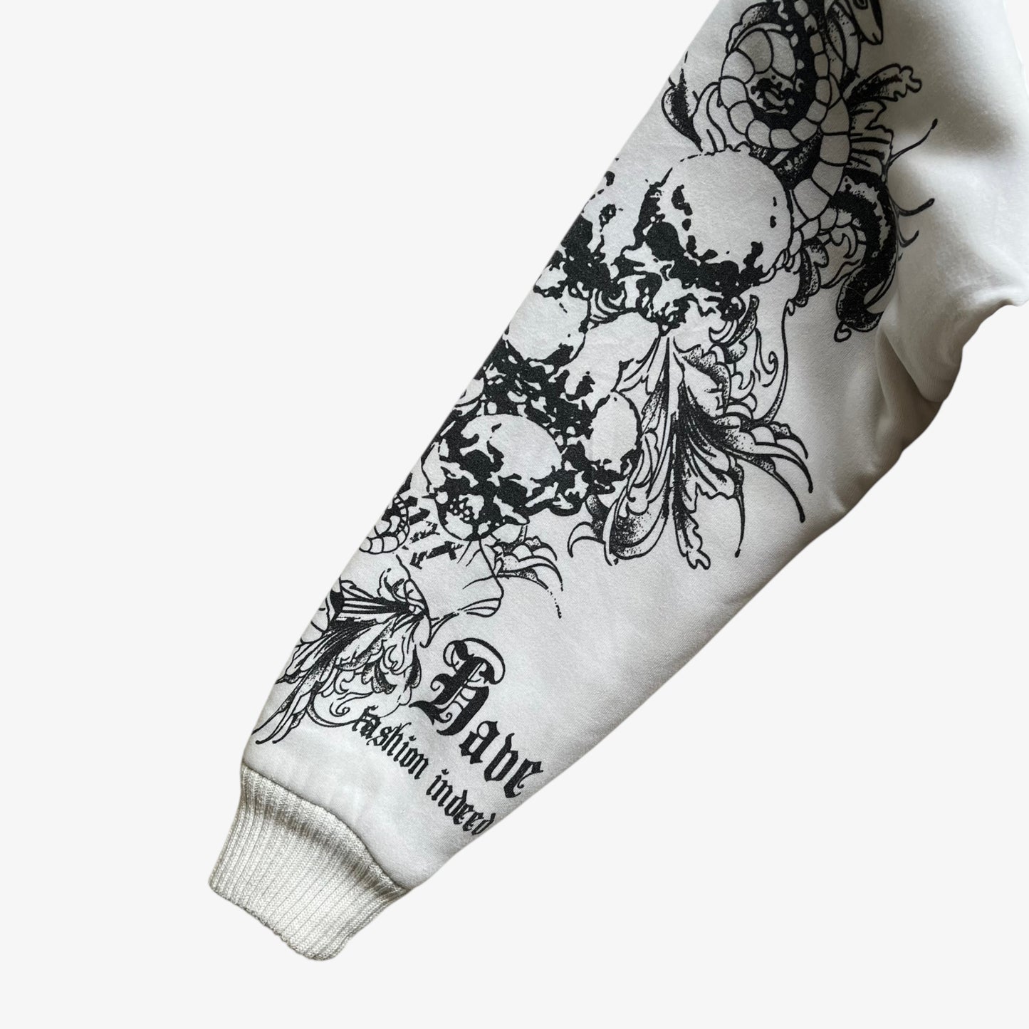 Skull and snake pattern on sleeve of vintage Y2K men's Really Point double sided print white hooded jacket with sherpa lining.
