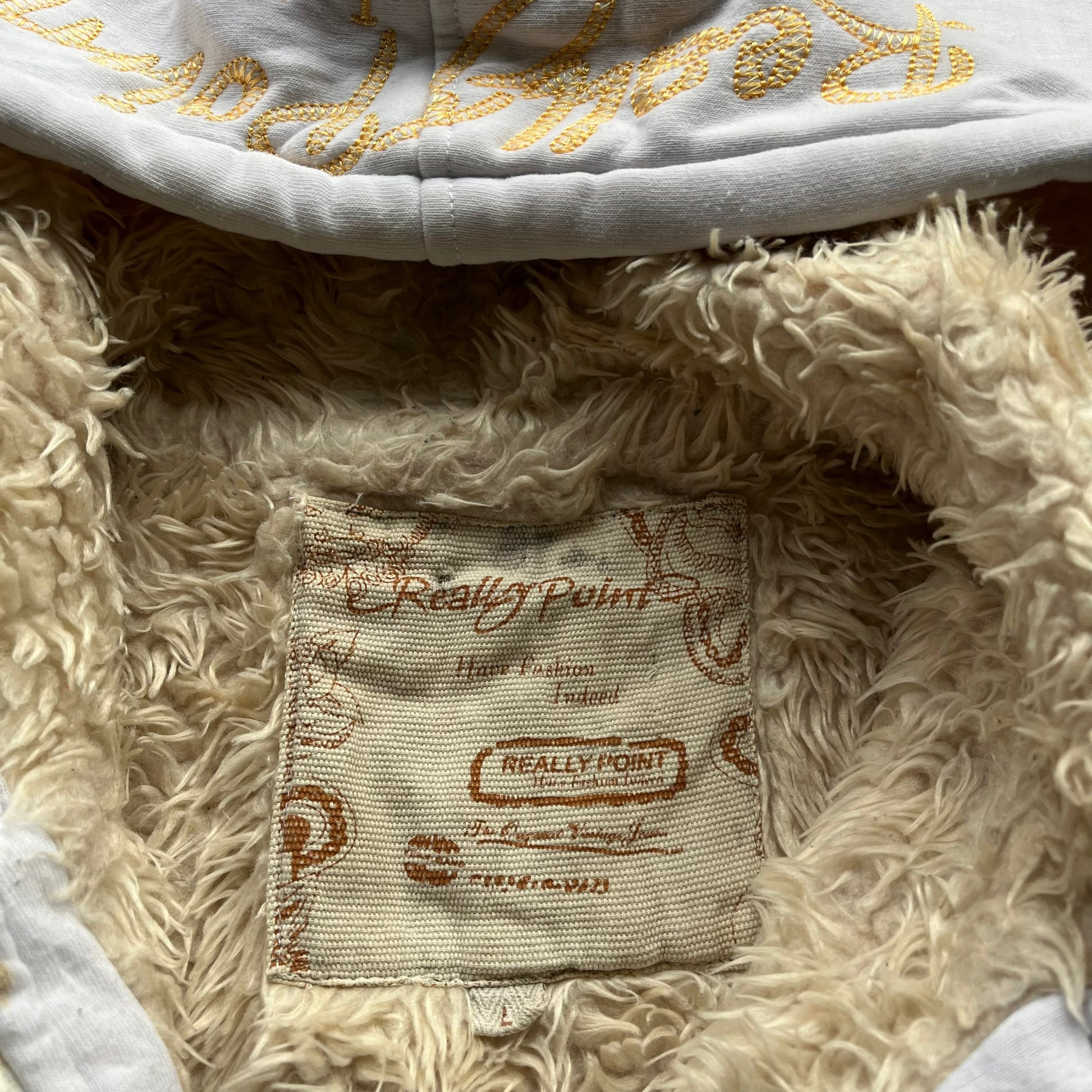 Really Point label stitched inside of vintage Y2K men's skull and snake double sided print white hooded jacket with sherpa lining.