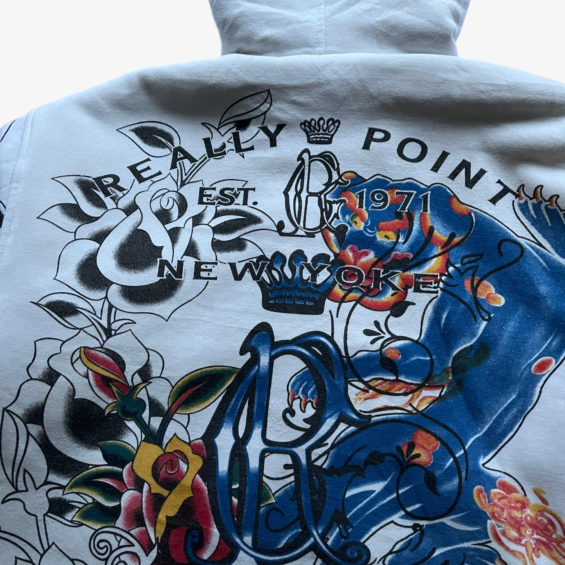 Patterned back of vintage Y2K men's Really Point skull and sword double sided print white jacket.