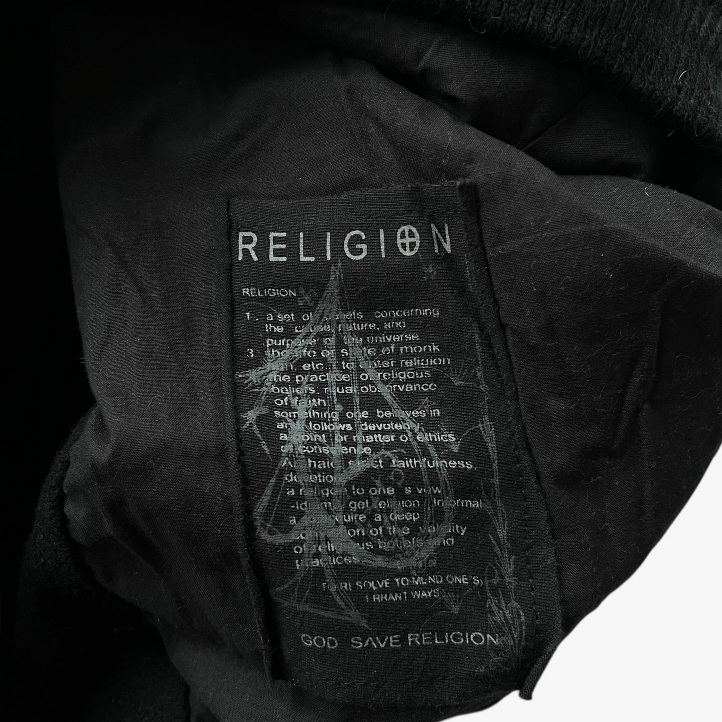 Black wool jacket with a label featuring the word religion.