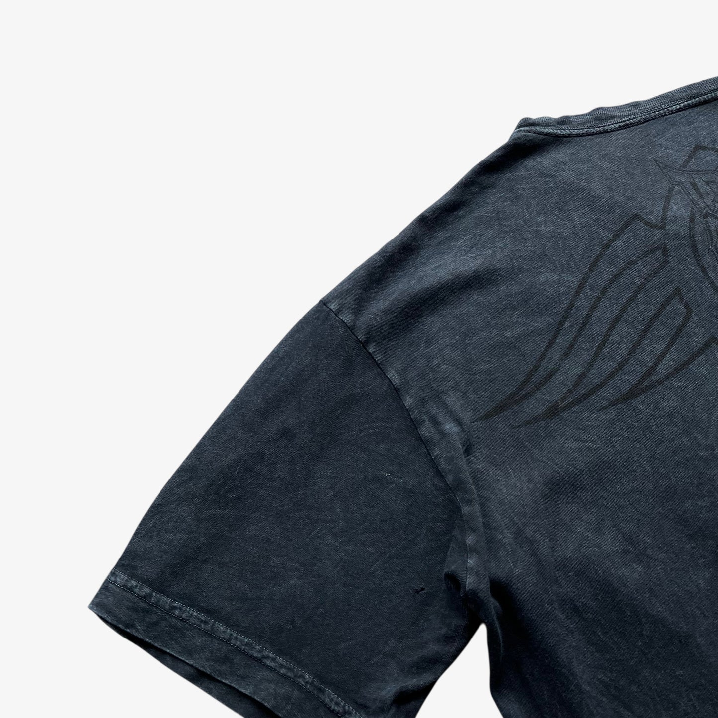 Close up of a cuff on a men's Y2K vintage Tapout navy t-shirt.