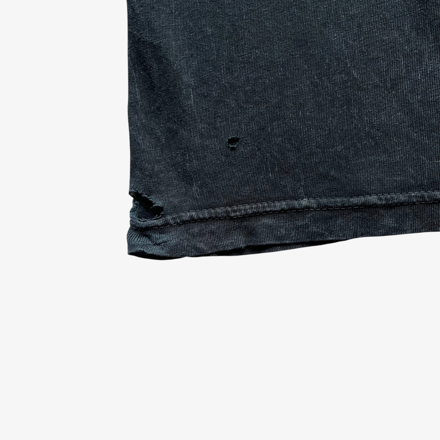 Thrashed hem on a vintage Y2K men's Tapout navy t-shirt.