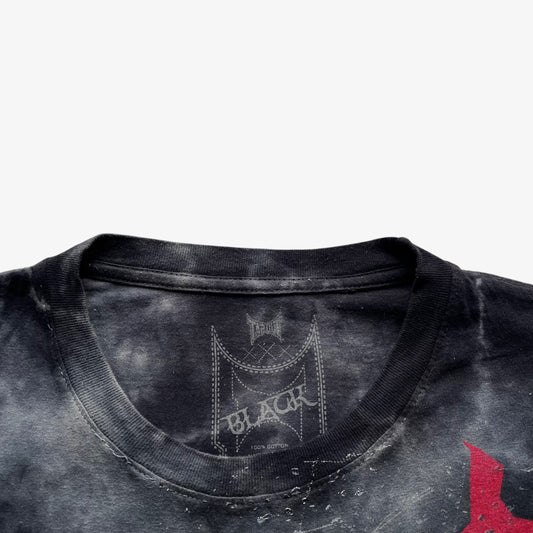 Tapout black line label printed inside of a men's vintage Y2K tie dye t-shirt.