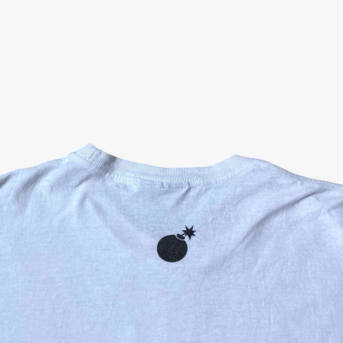 The Hundreds logo on the back of vintage Y2K men's Gigi woman print white t-shirt.