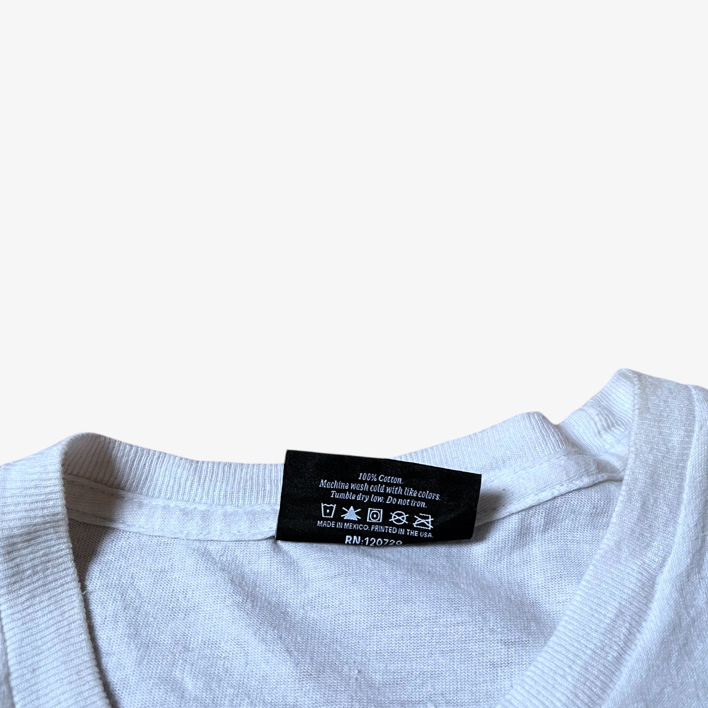 Inside label of vintage Y2K men's The Hundreds Gigi woman print white t-shirt.
