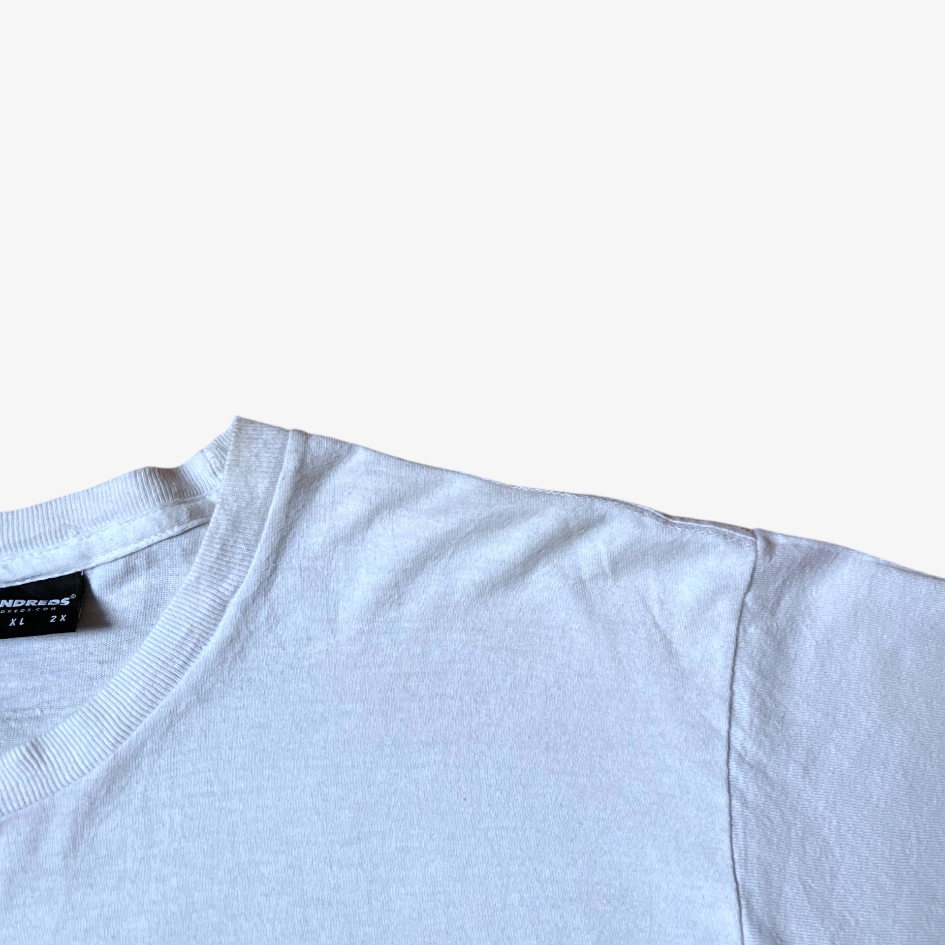 Wear on vintage Y2K men's The Hundreds Gigi woman print white t-shirt.