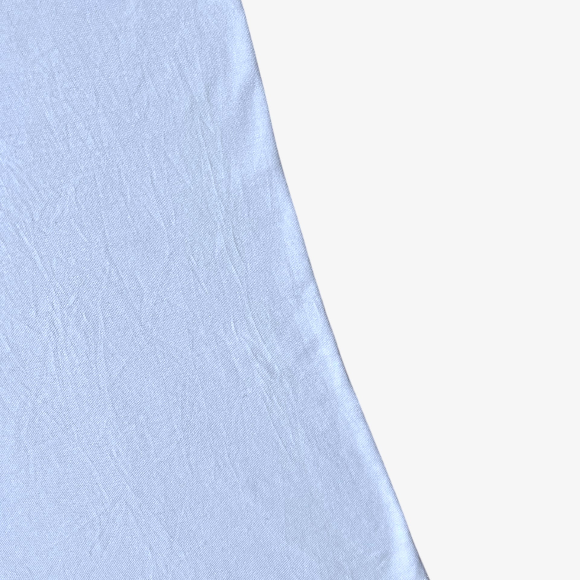 Wear on the side of vintage Y2K men's The Hundreds Gigi woman print white t-shirt.