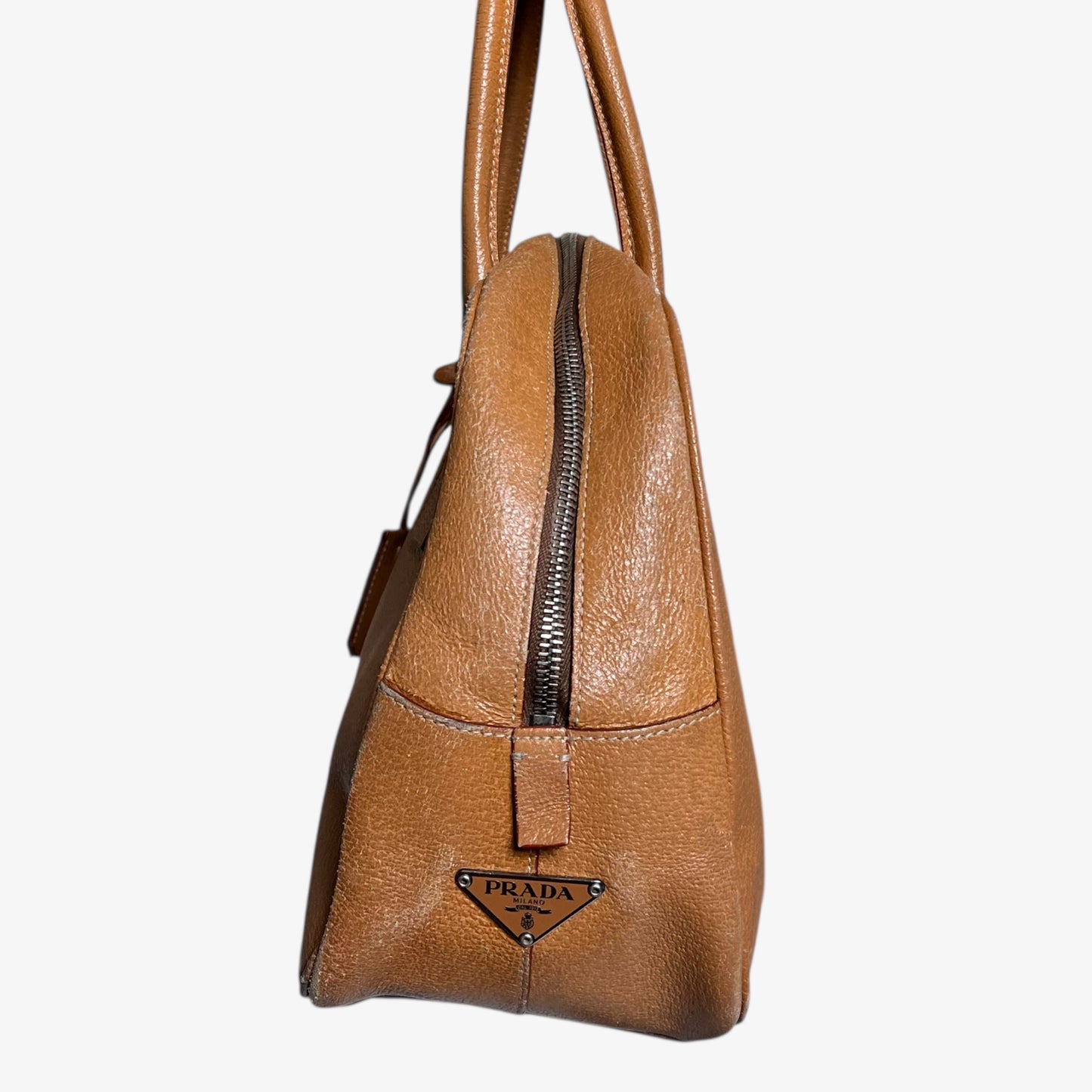 Side of vintage Y2K Prada Cinghiale sport brown leather Bauletto shoulder bag.