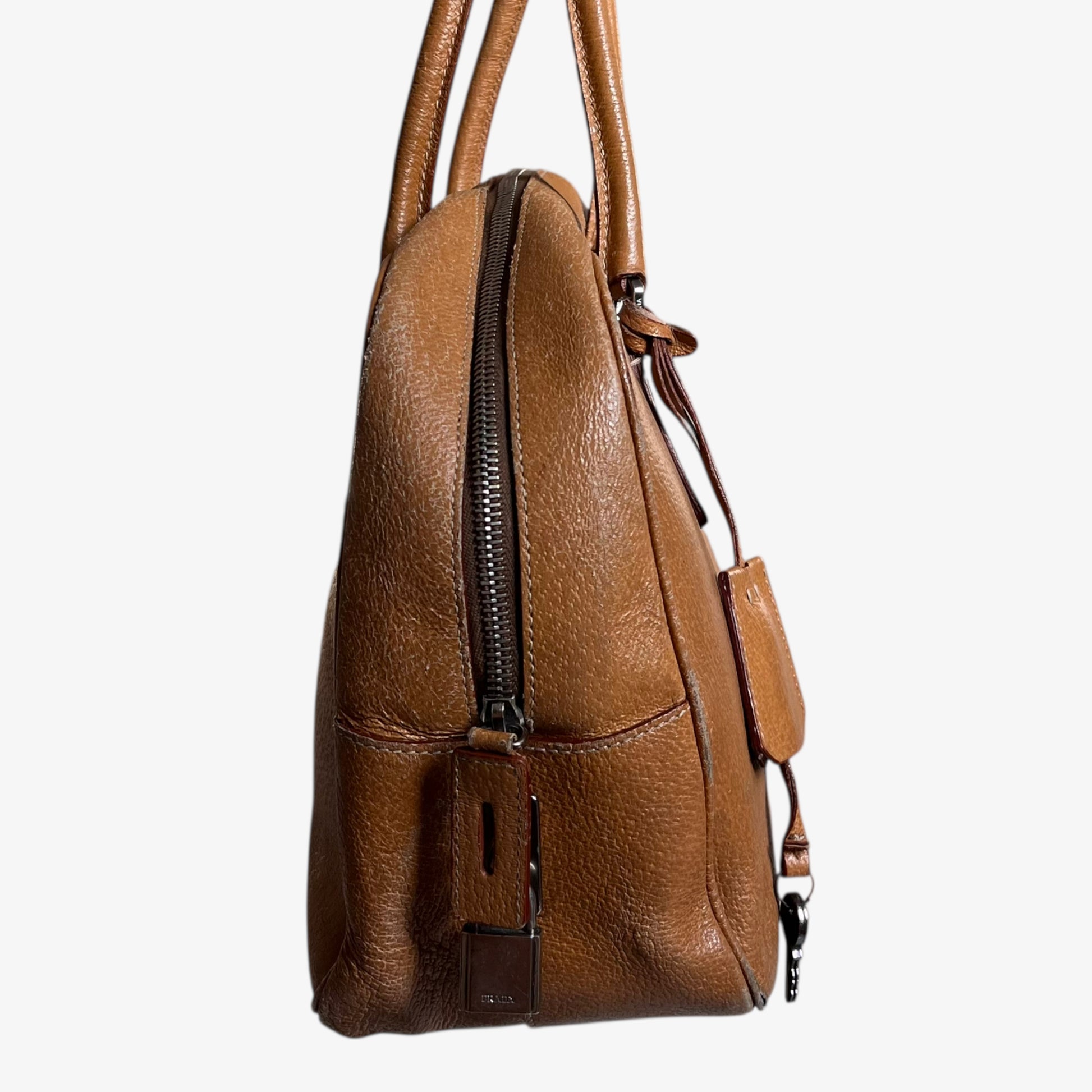 Zipper of vintage Y2K Prada Cinghiale sport brown leather Bauletto shoulder bag.