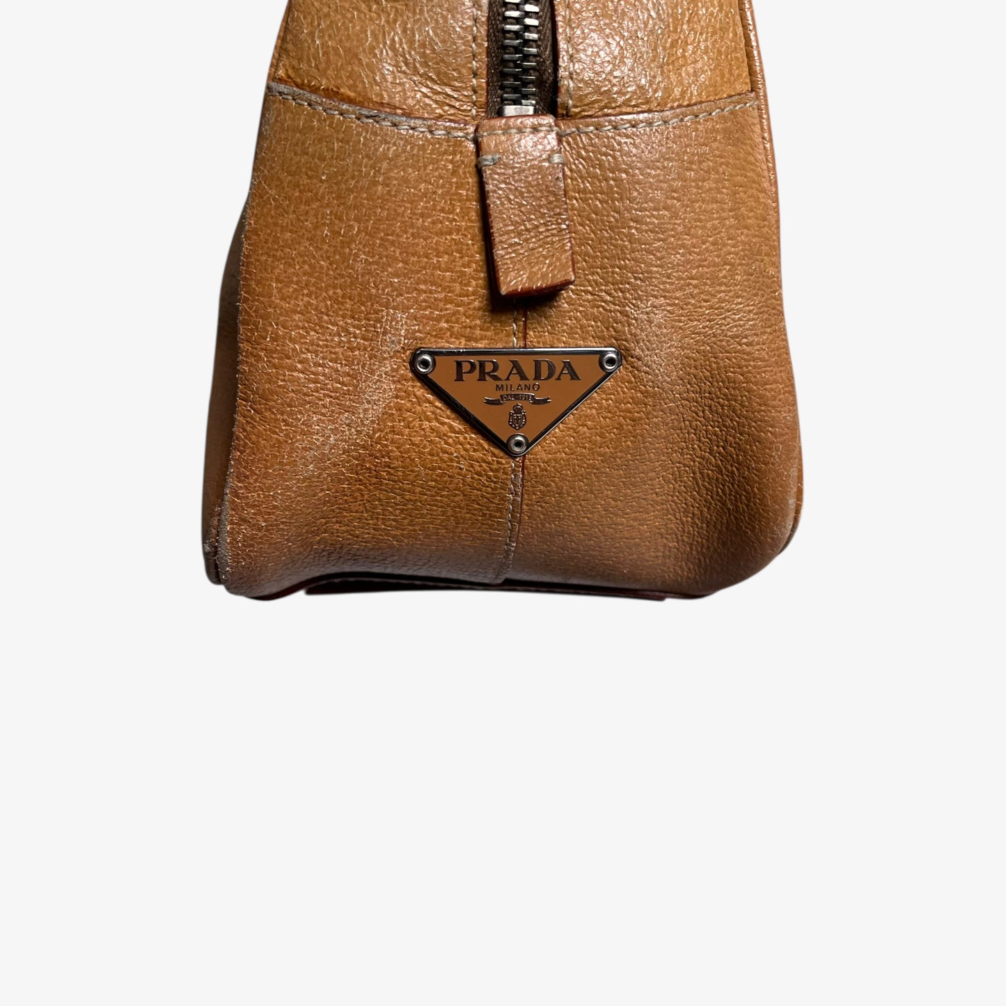 Prada logo on the side of vintage Y2K Cinghiale sport brown leather Bauletto shoulder bag.