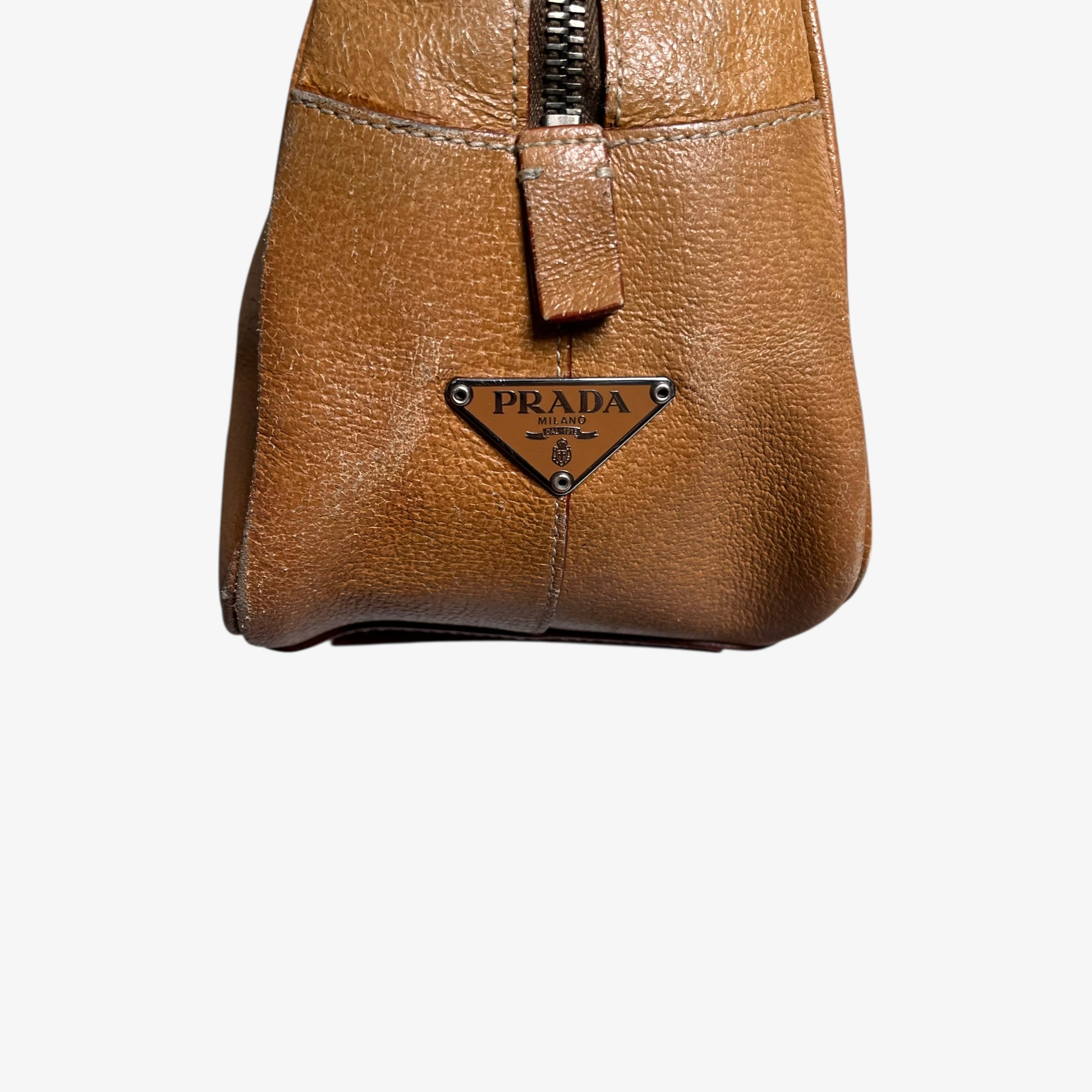 Prada logo on the side of vintage Y2K Cinghiale sport brown leather Bauletto shoulder bag.