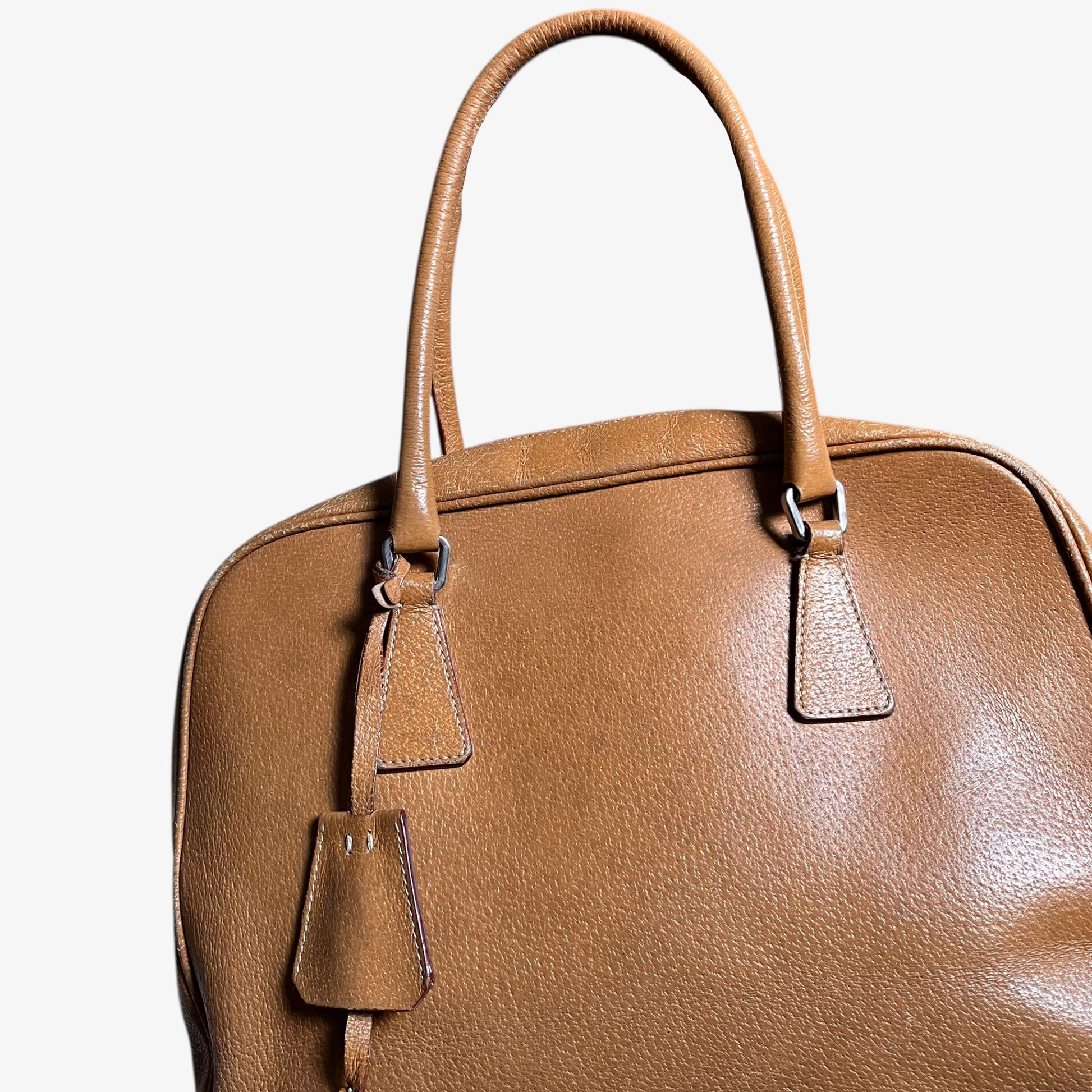Wear on vintage Y2K Prada Cinghiale sport brown leather Bauletto shoulder bag.