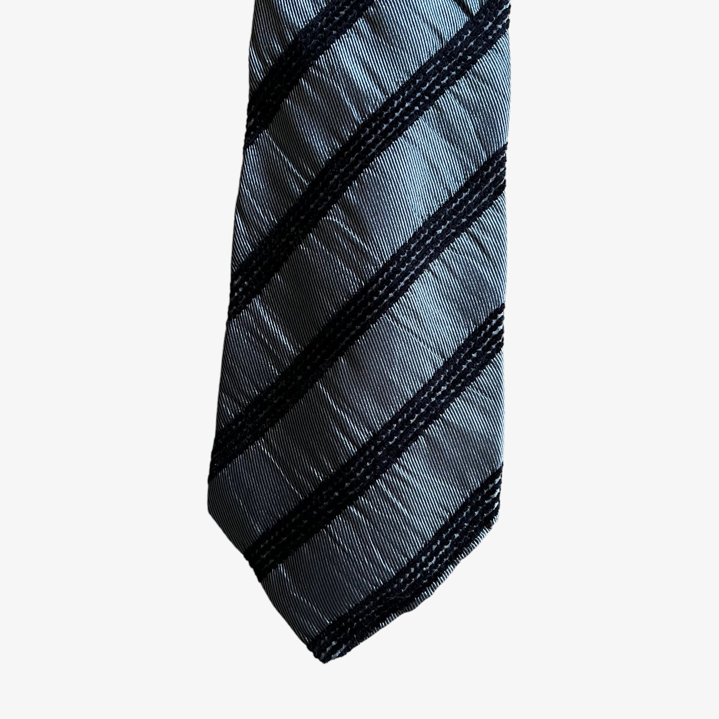 Close up of pattern of vintage Y2K Sonia Rykiel homme grey striped silk tie.
