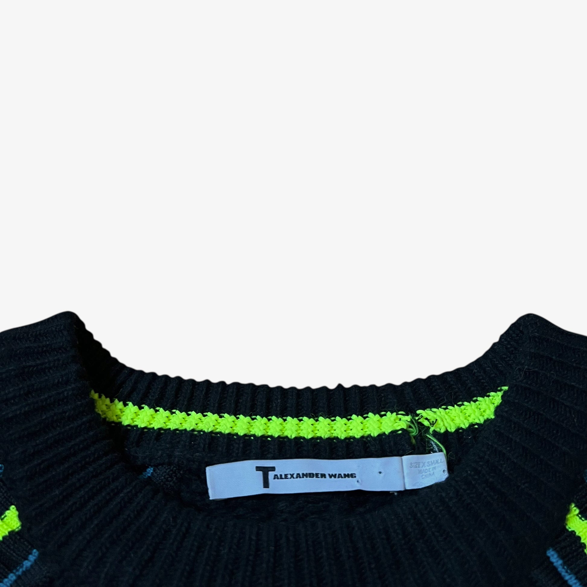 T by Alexander Wang label stitched inside the neck of vintage Y2K women's neon trimmed cashmere and merino wool blend black cable knit jumper.