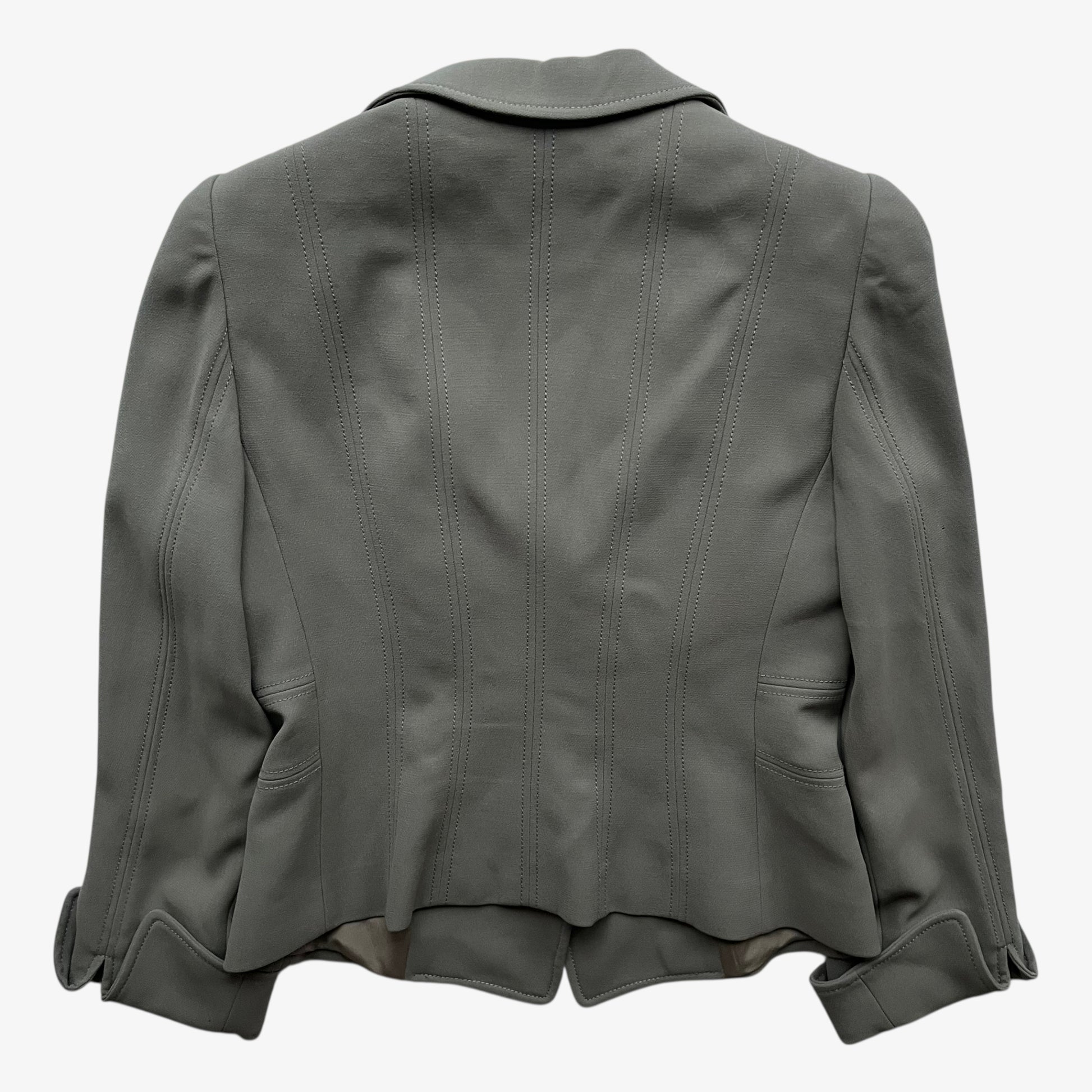 Back of a vintage Y2K women's Armani Collezioni grey single breasted blazer on a white background.