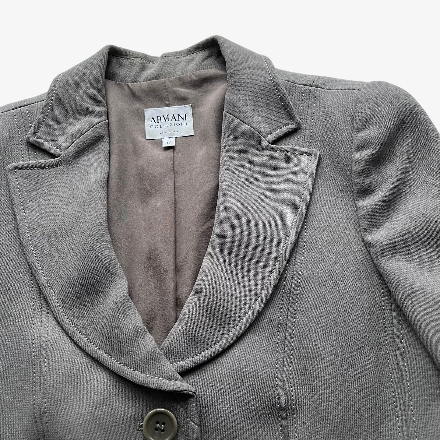 Close up of collar on a vintage Y2K women's Armani Collezioni grey single breasted blazer.