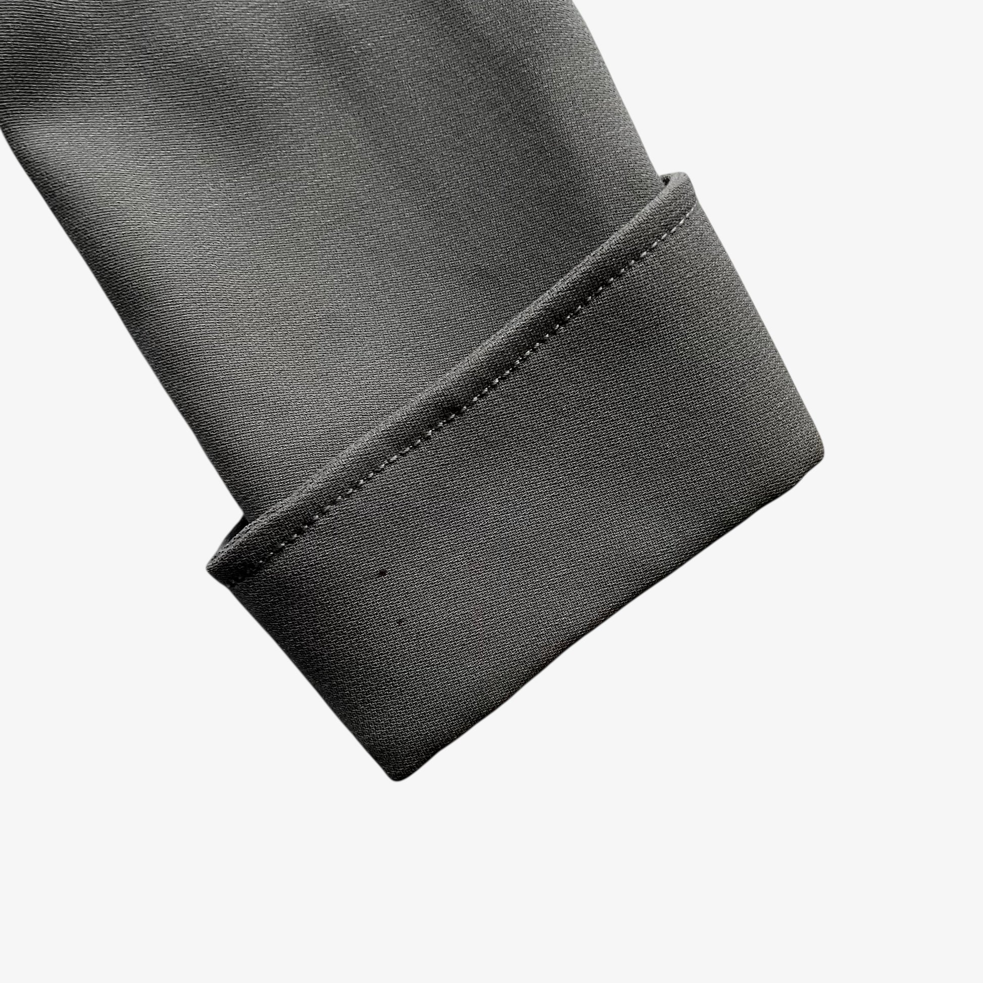 Close up of cuff on a vintage Y2K women's Armani Collezioni grey single breasted blazer.