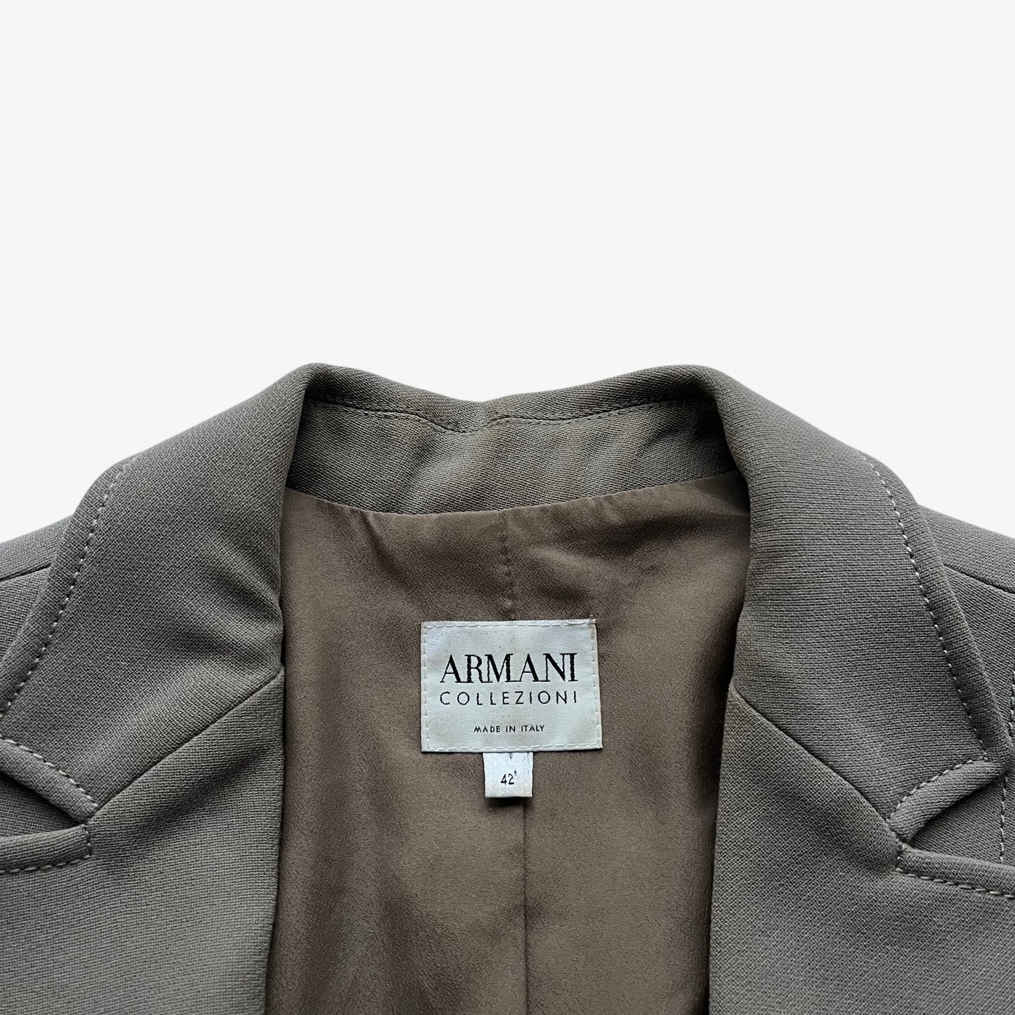 Vintage Y2K Armani Collezioni label stitched inside of a women's grey single breasted blazer.