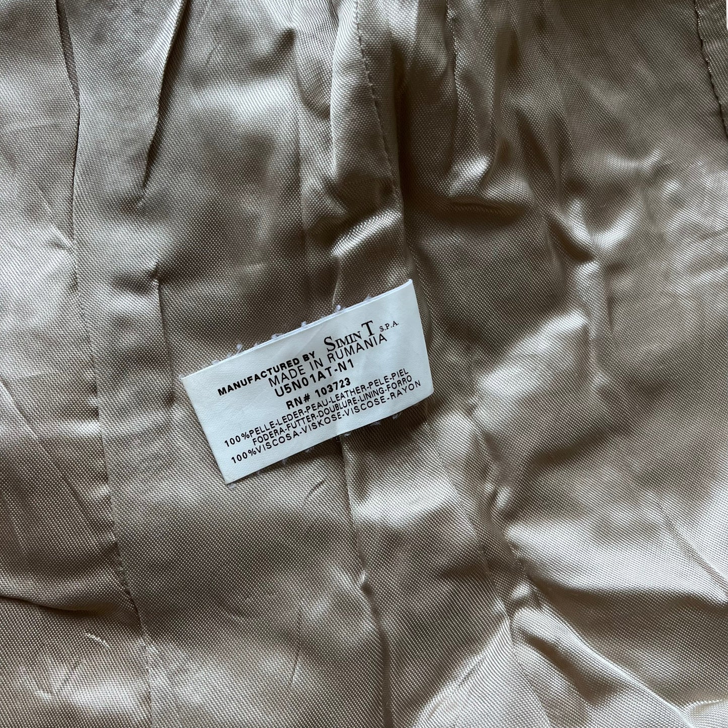 Inside label of women's vintage Y2K Armani Jeans cream leather blazer.