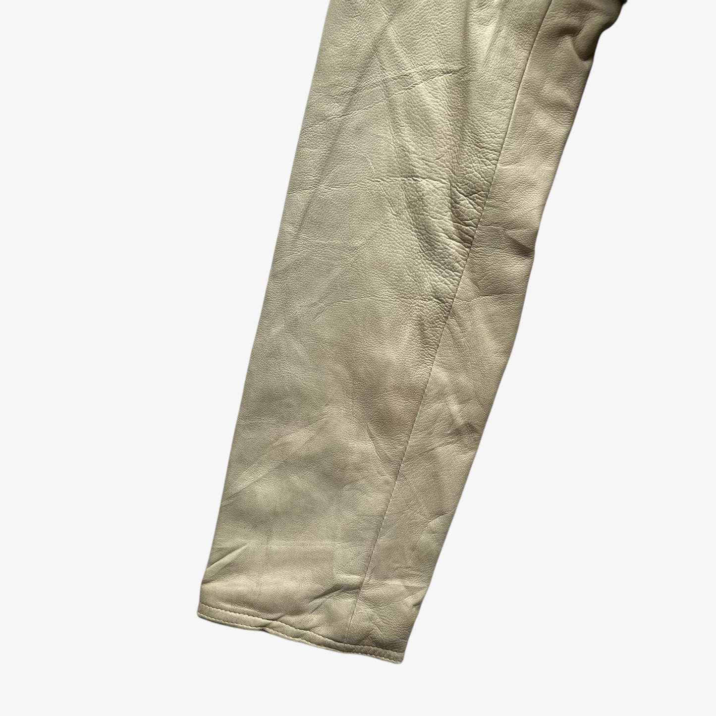 Sleeve of women's vintage Y2K Armani Jeans cream leather blazer.