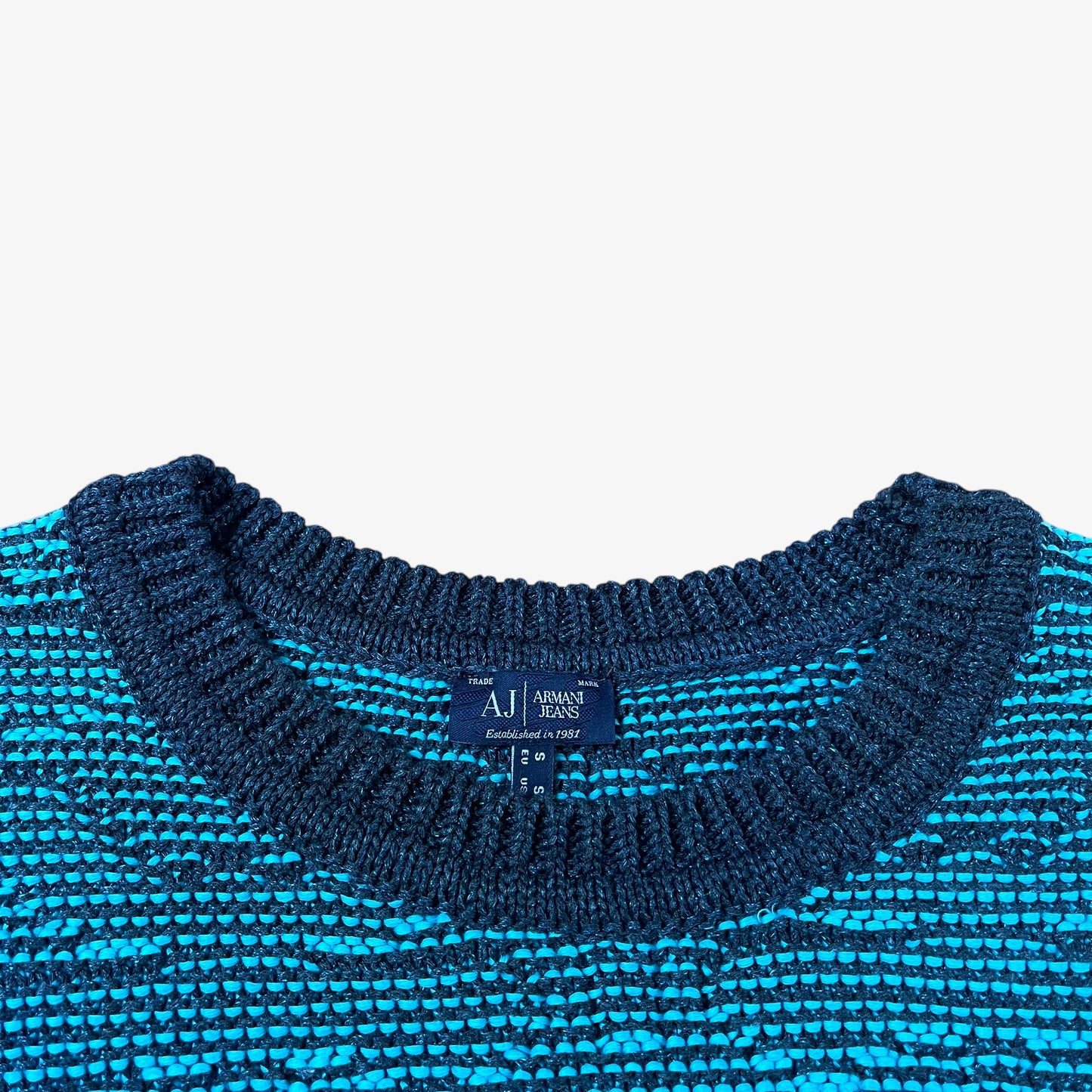 Label of vintage Y2K Armani Jeans women’s blue knitted short sleeve top.