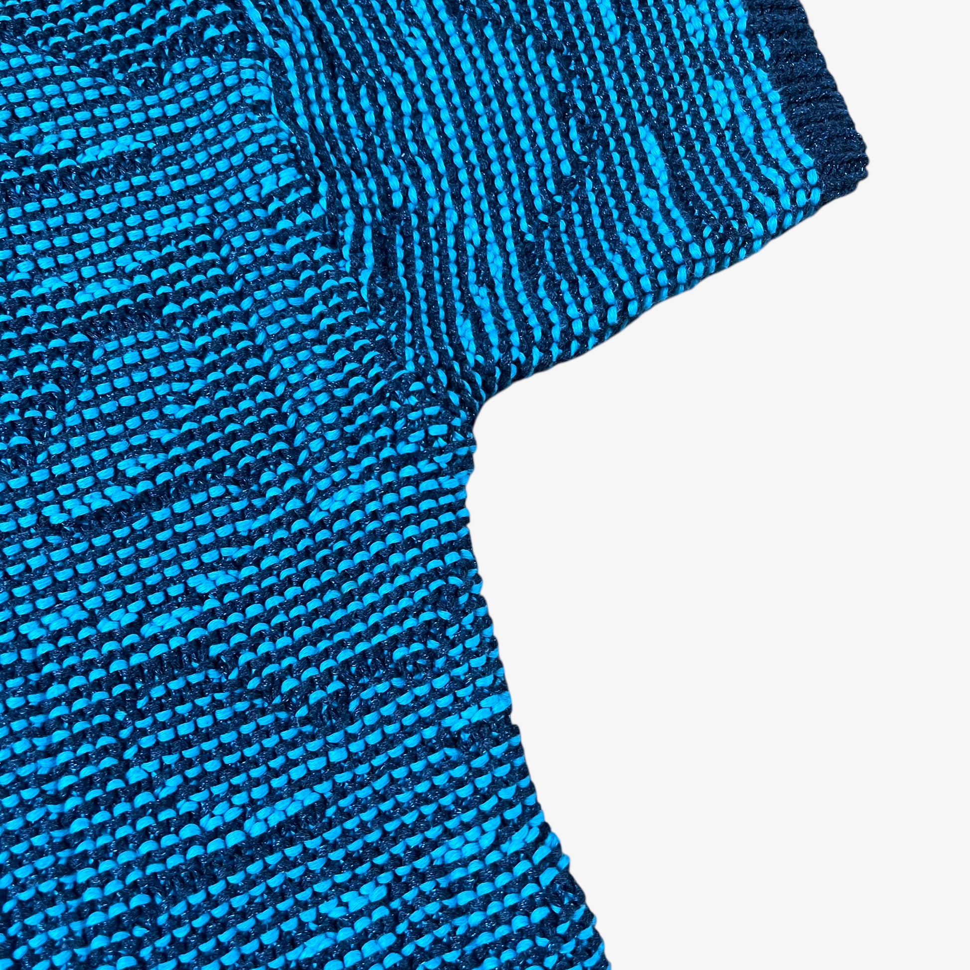 Sleeve of vintage Y2K Armani Jeans women’s blue knitted short sleeve top.