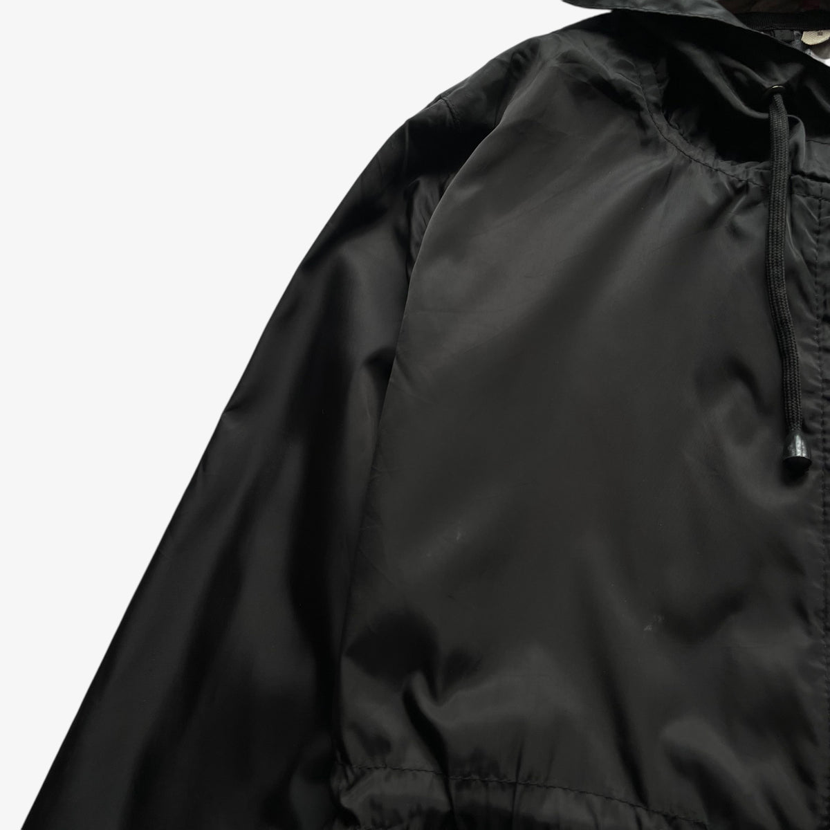 General wear on vintage Y2K women's Burberry black hooded jacket.