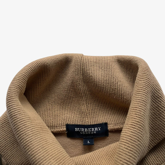 Vintage Y2K Burberry label stitched inside the neck of a women's cotton turtleneck jumper featuring a nova check stripe.