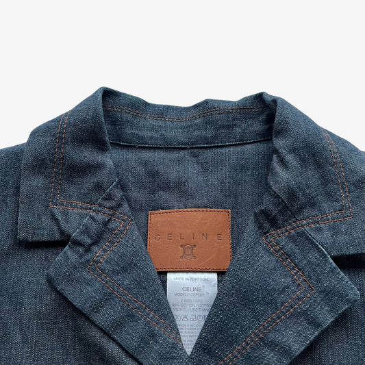 Vintage Y2K Celine leather brand label stitched inside of a blue denim jacket.