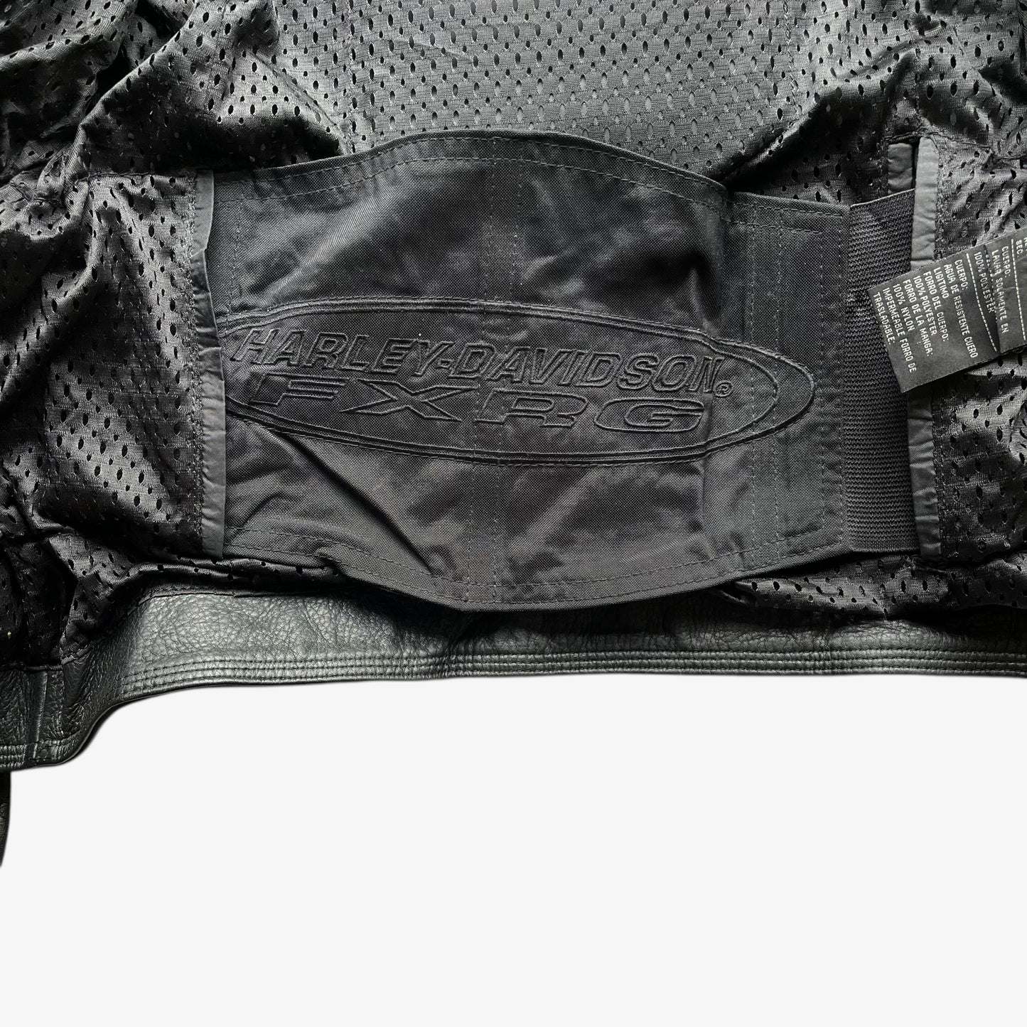 Harley Davidson FXRG logo on inside belt of vintage Y2K women's Harley Davidson FXRG Series 1 padded black leather biker jacket.