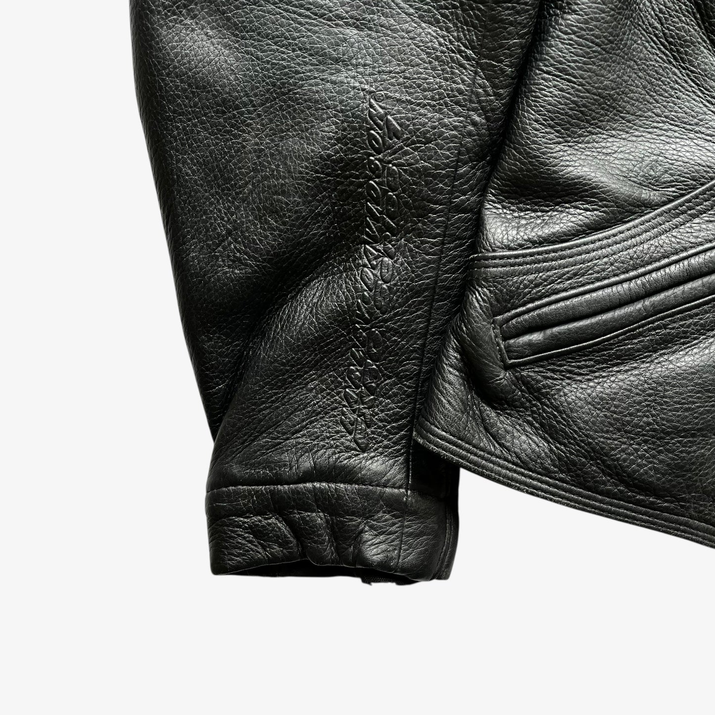 Harley Davidson FXRG Series 1 embossed spell out logo on the sleeve of vintage Y2K women's padded black leather biker jacket.