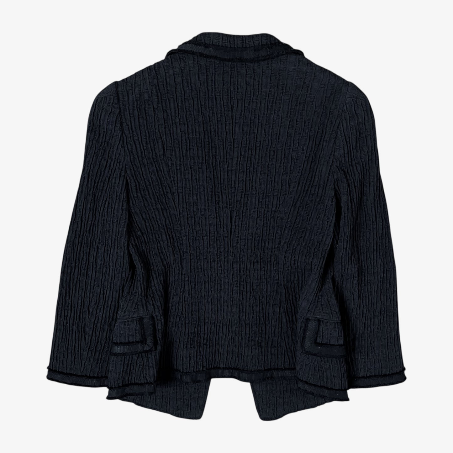 Back of vintage Y2K Moschino women’s black ribbed blazer with structured fit and classic tailored design.