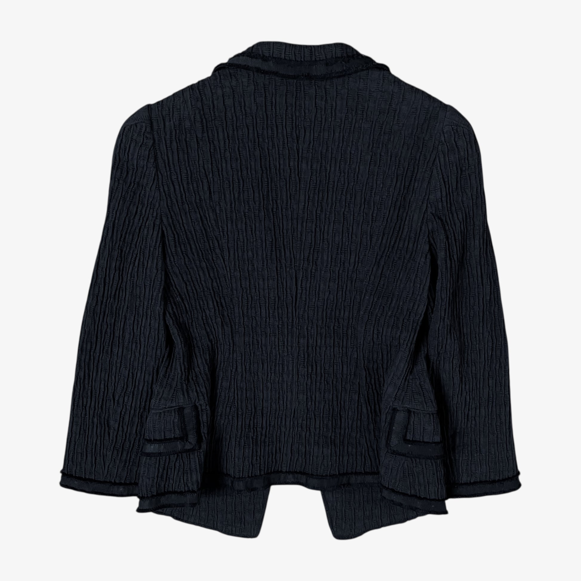 Back of vintage Y2K Moschino women’s black ribbed blazer with structured fit and classic tailored design.