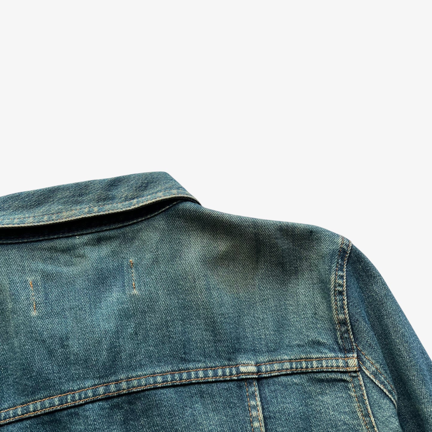 Collar of vintage Y2K women's Moschino jeans blue denim trucker jacket.