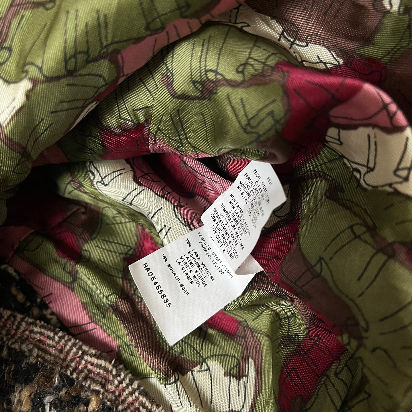 Material label of vintage Y2K women's Moschino textured wool and mohair single breasted blazer.