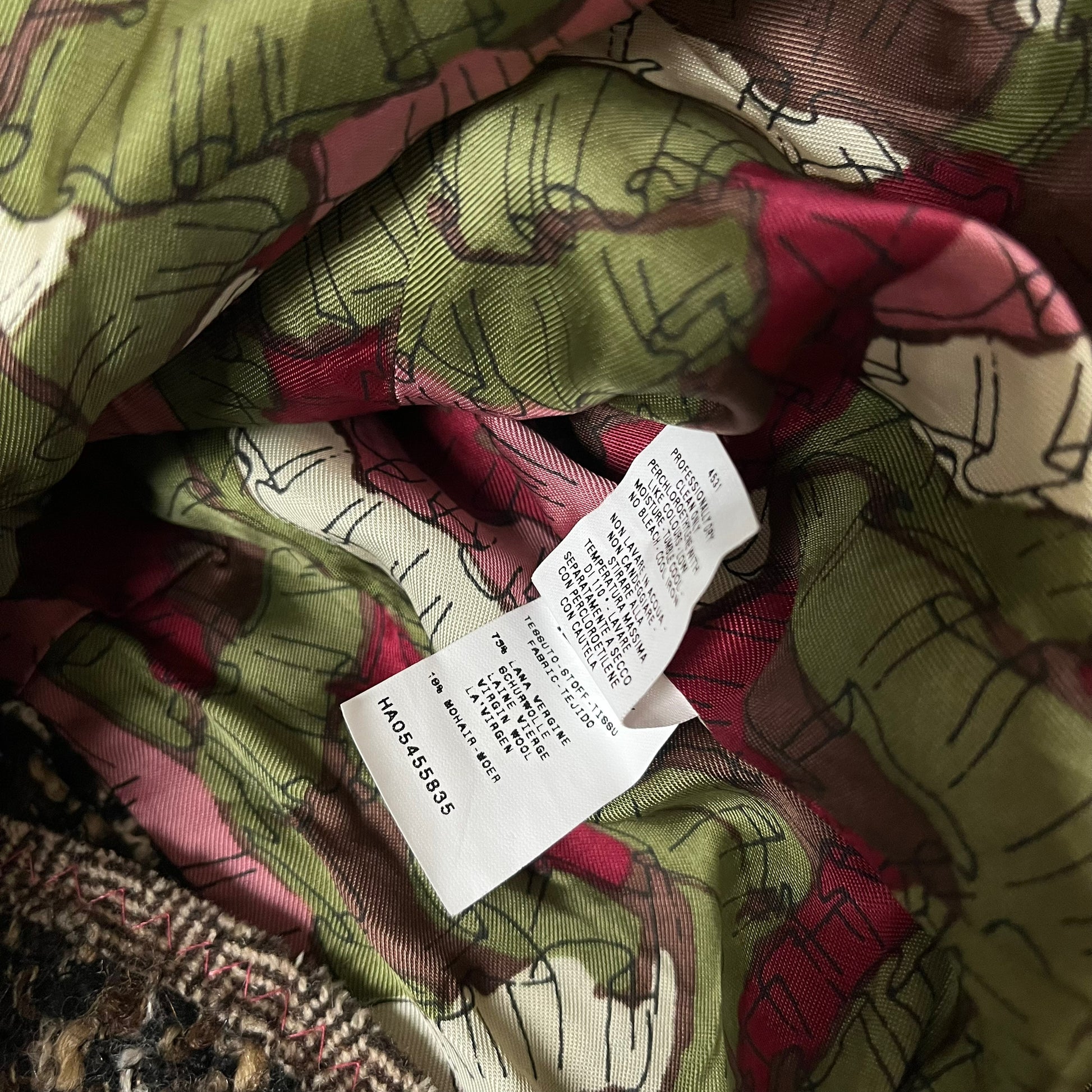 Material label of vintage Y2K women's Moschino textured wool and mohair single breasted blazer.