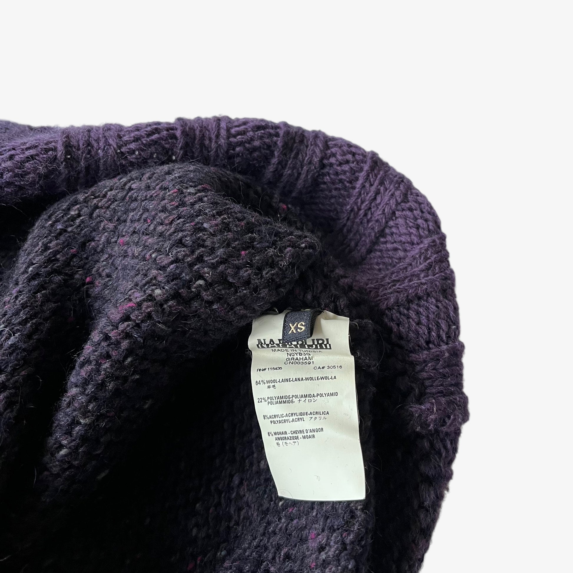 Napapijri material label stitched inside on a vintage purple wool turtleneck jumper.