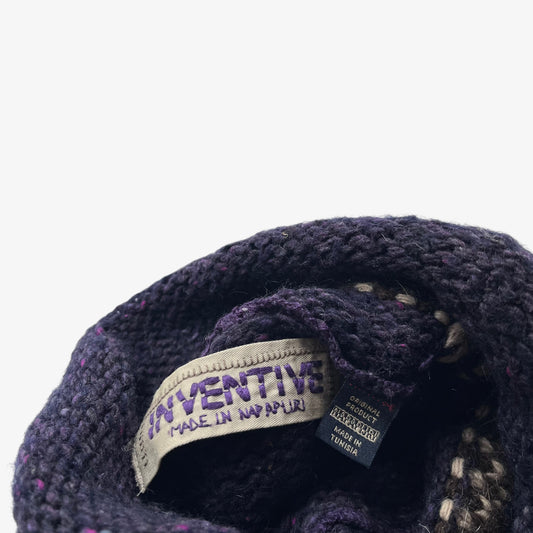 Napapijri inventive label stitched inside of a purple wool turtleneck jumper on a white background.
