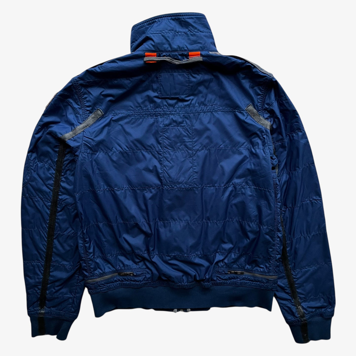 Back of vintage Y2K women's Parajumpers USAF 210 rescue squadron blue utility jacket.