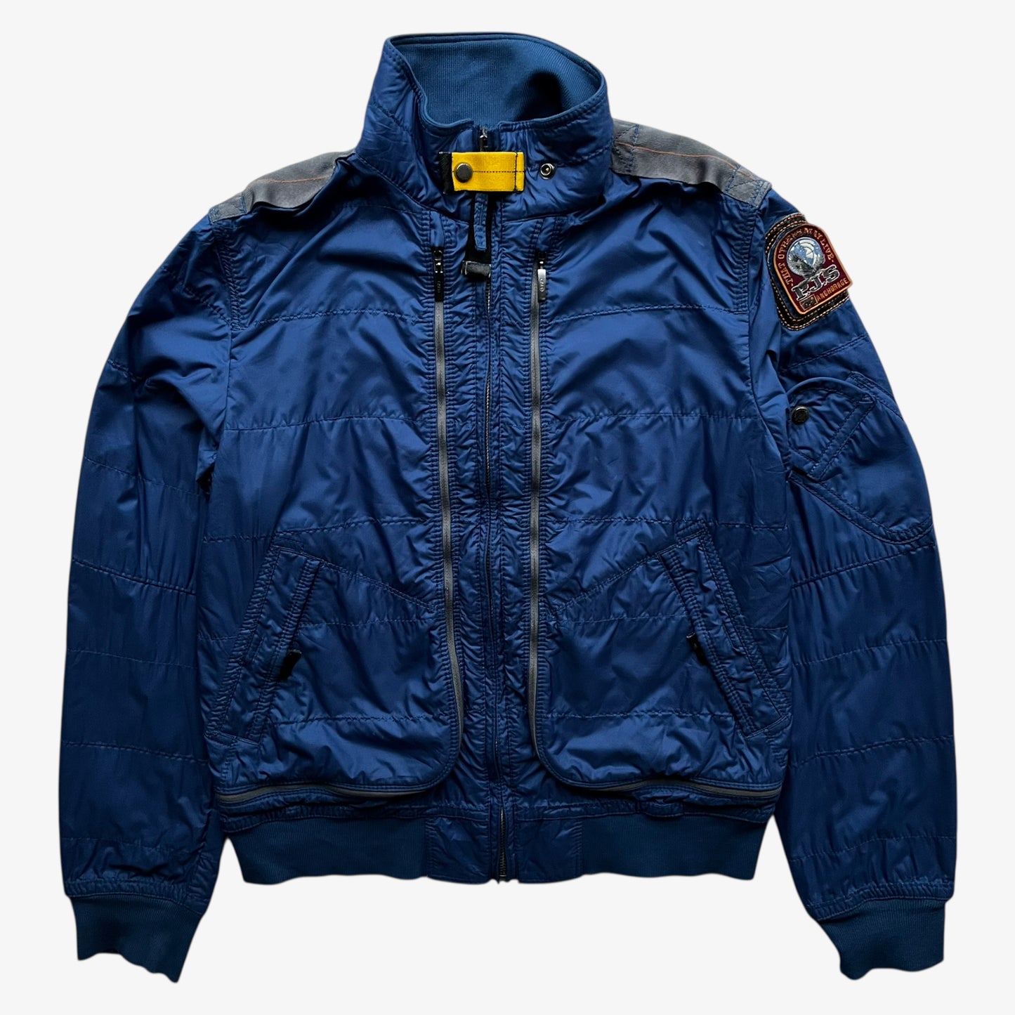 Vintage Y2K women's Parajumpers USAF 210 rescue squadron blue utility jacket.