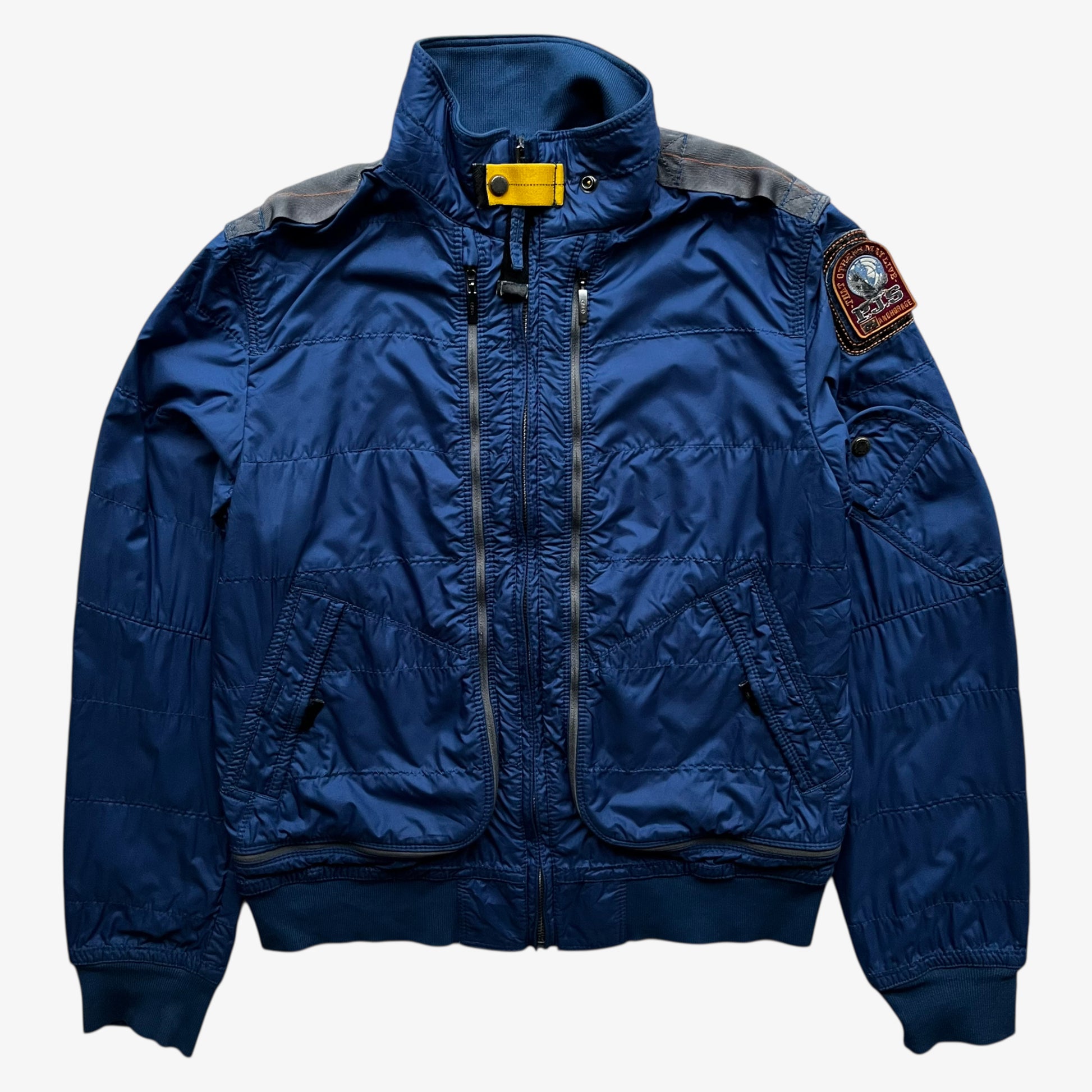 Vintage Y2K women's Parajumpers USAF 210 rescue squadron blue utility jacket.